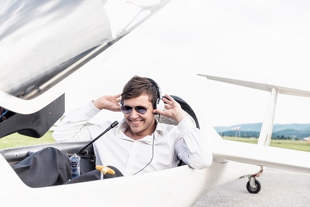 stock-photo-22076668-smiling-corporate-jet-pilot-captain[1]