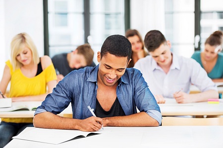 stock-photo-21189222-group-of-students-writing-in-the-classroom